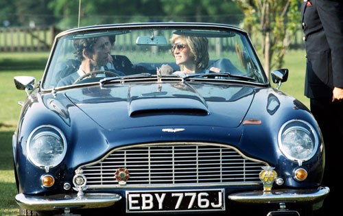 Prince Charles and Princess Diana watch a polo match from the comfort of his DB6 Volante