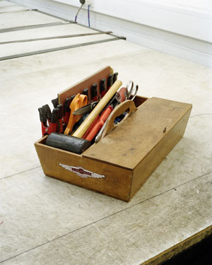 John Croot's classic wooden tool box, a gift from his father, who also worked at Aston Martin